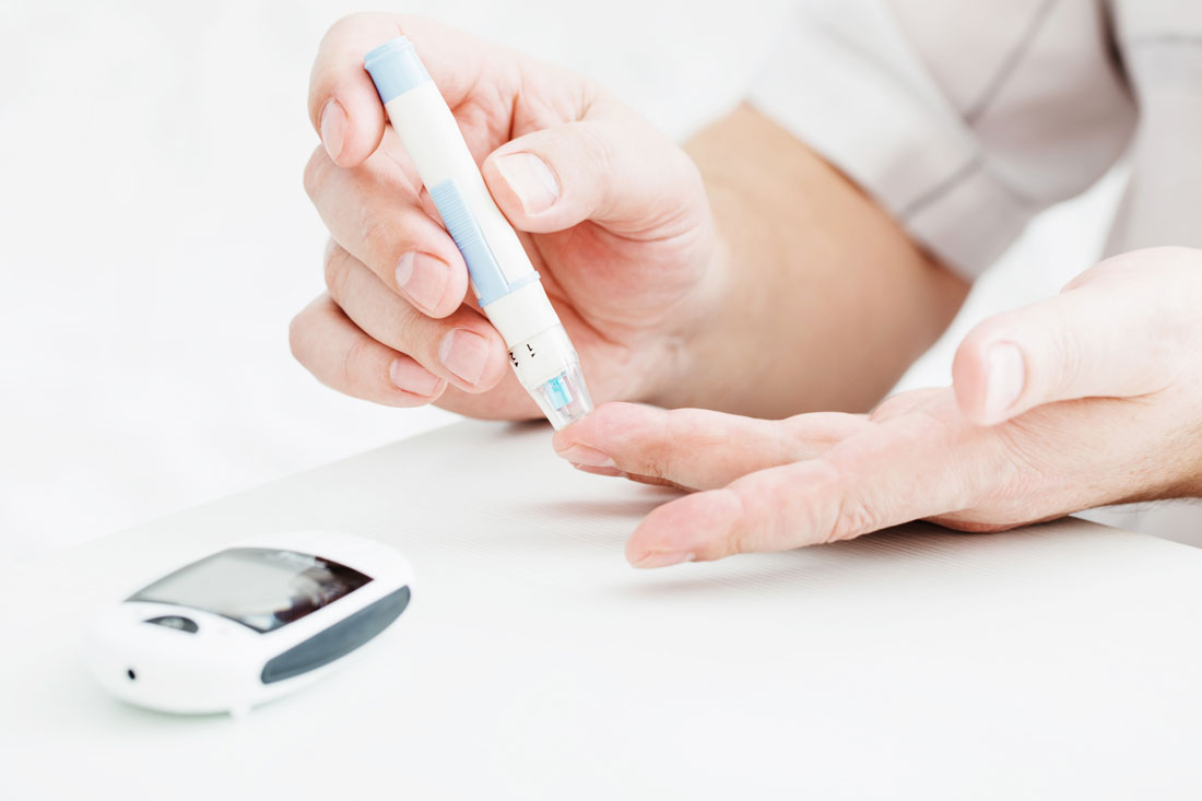 A person with diabetes checking their blood sugar