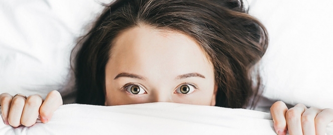 Woman who is too tired to sleep.
